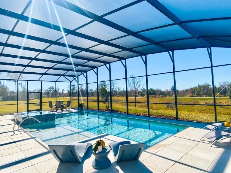 https://artesianpools.com/wp-content/uploads/2025/08/residential-inground-swimming-pool-project-artesian-pools-orlando-12.webp